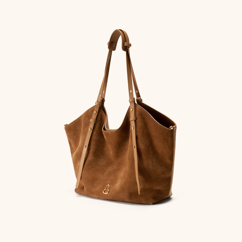 Side View of the Bampo Fulfill Double Faced Suede Tote#color_caramel