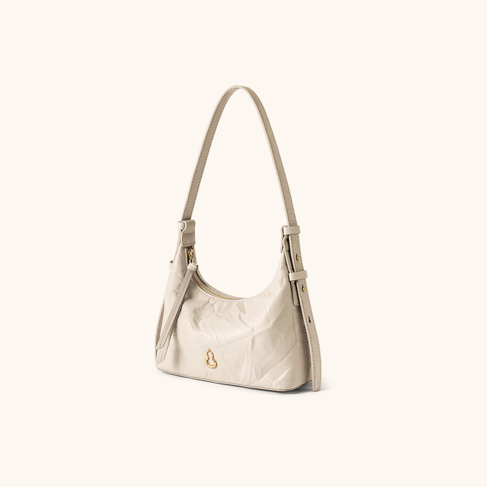 Side View of the Bampo Glow Hobo#color_silky-cream