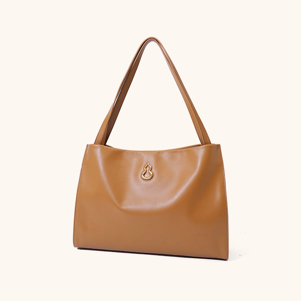 Side View of the Bampo Large Land Tote#color_caramel-glow