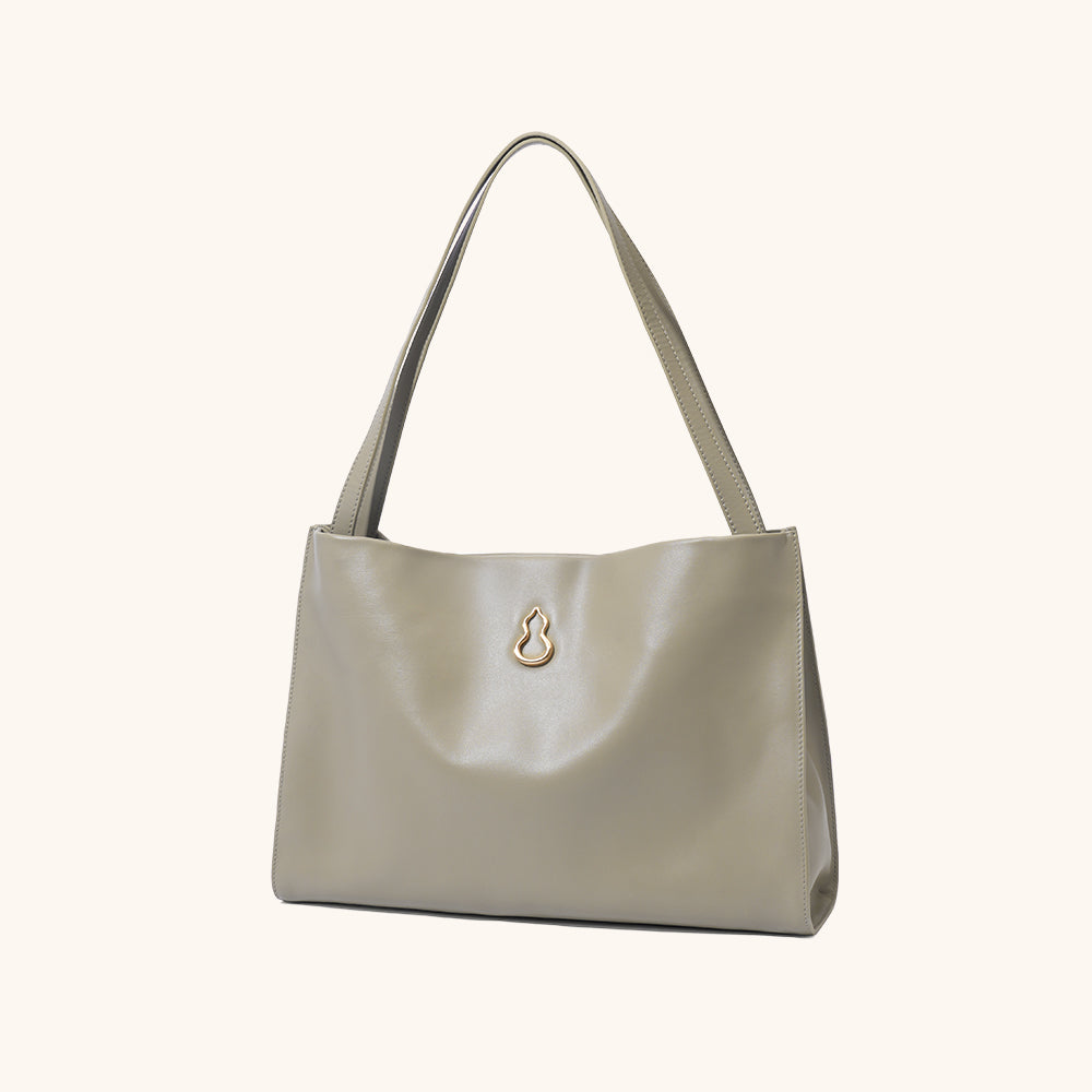 Side View of the Bampo Large Land Tote#color_warm-taupe