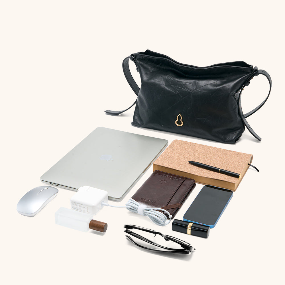 Items laid out to show Bampo Medium Flow Hobo capacity