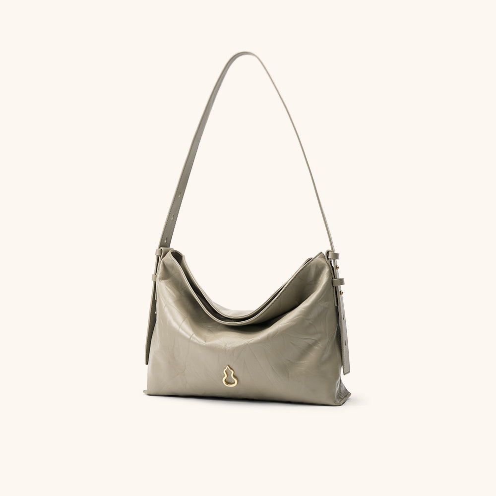Side View of the Bampo Medium Flow Hobo#color_warm-taupe