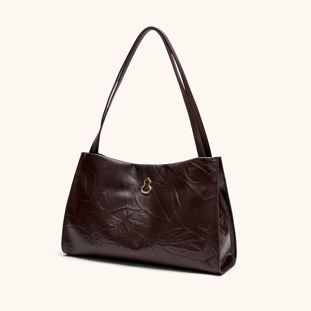 Side View of the Bampo Medium Land Tote (Texture Version)#color_mahogany-night-brown