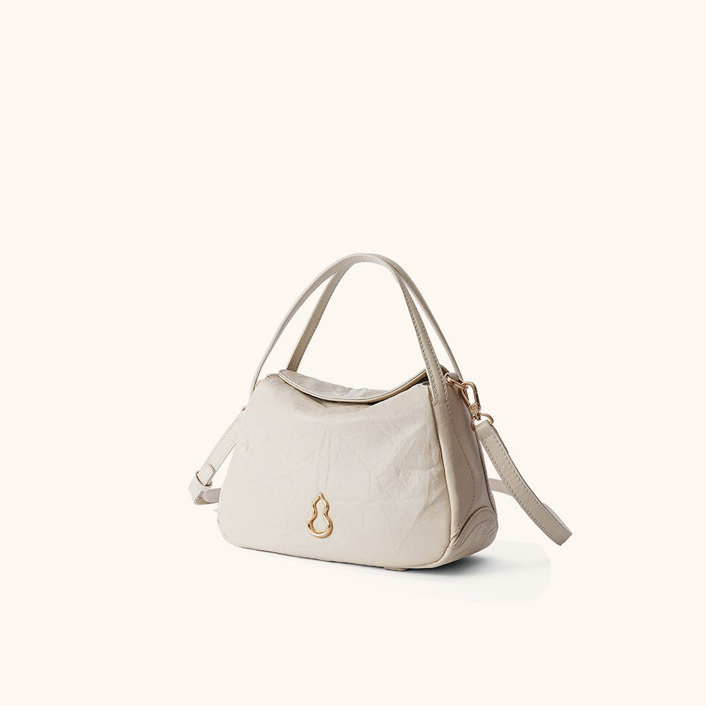 Side View of the Bampo Small Harmony Tote (Texture Version)#color_silky-cream