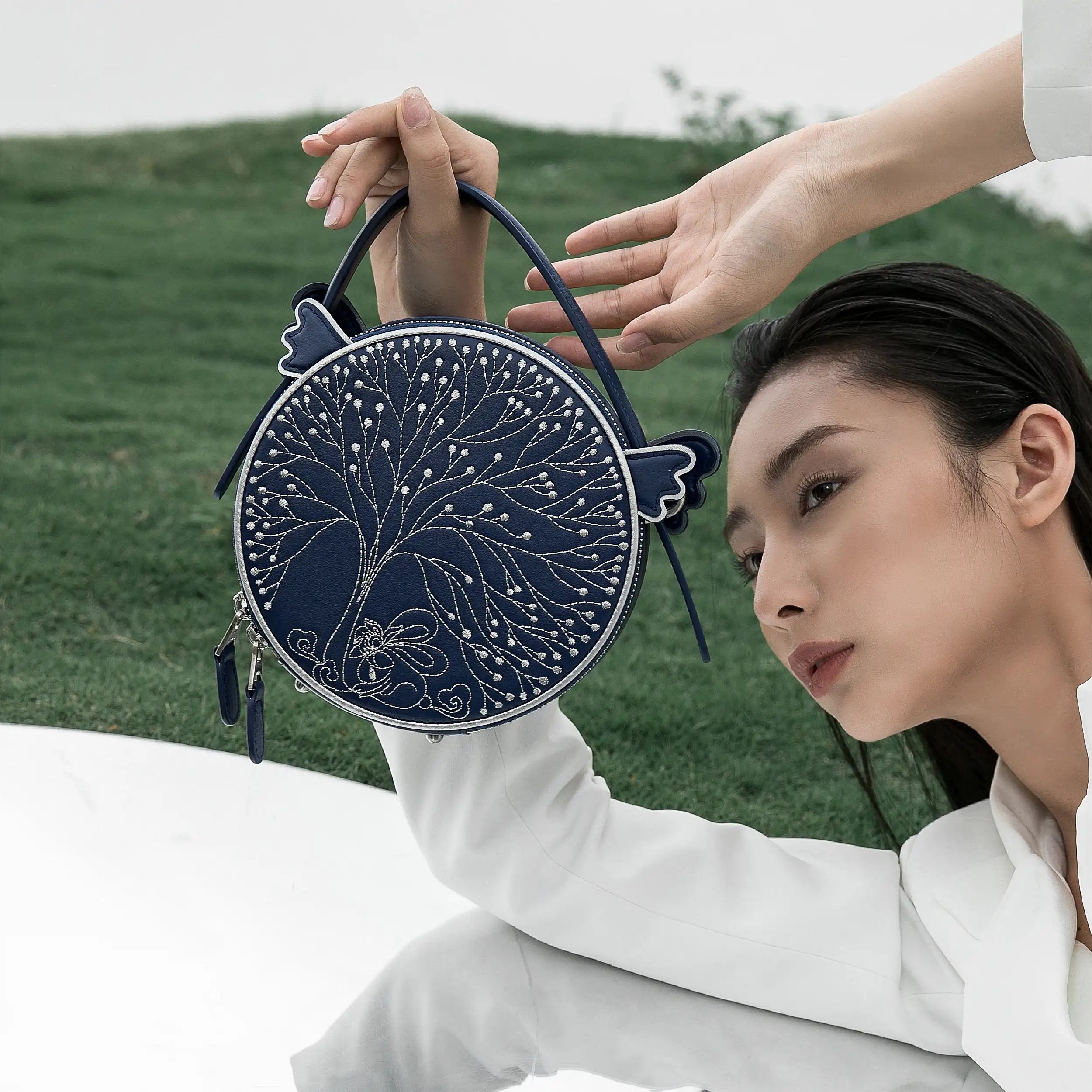 Fairyland small dark blue leather handbag | Bampo