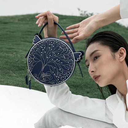 Fairyland small dark blue leather handbag | Bampo