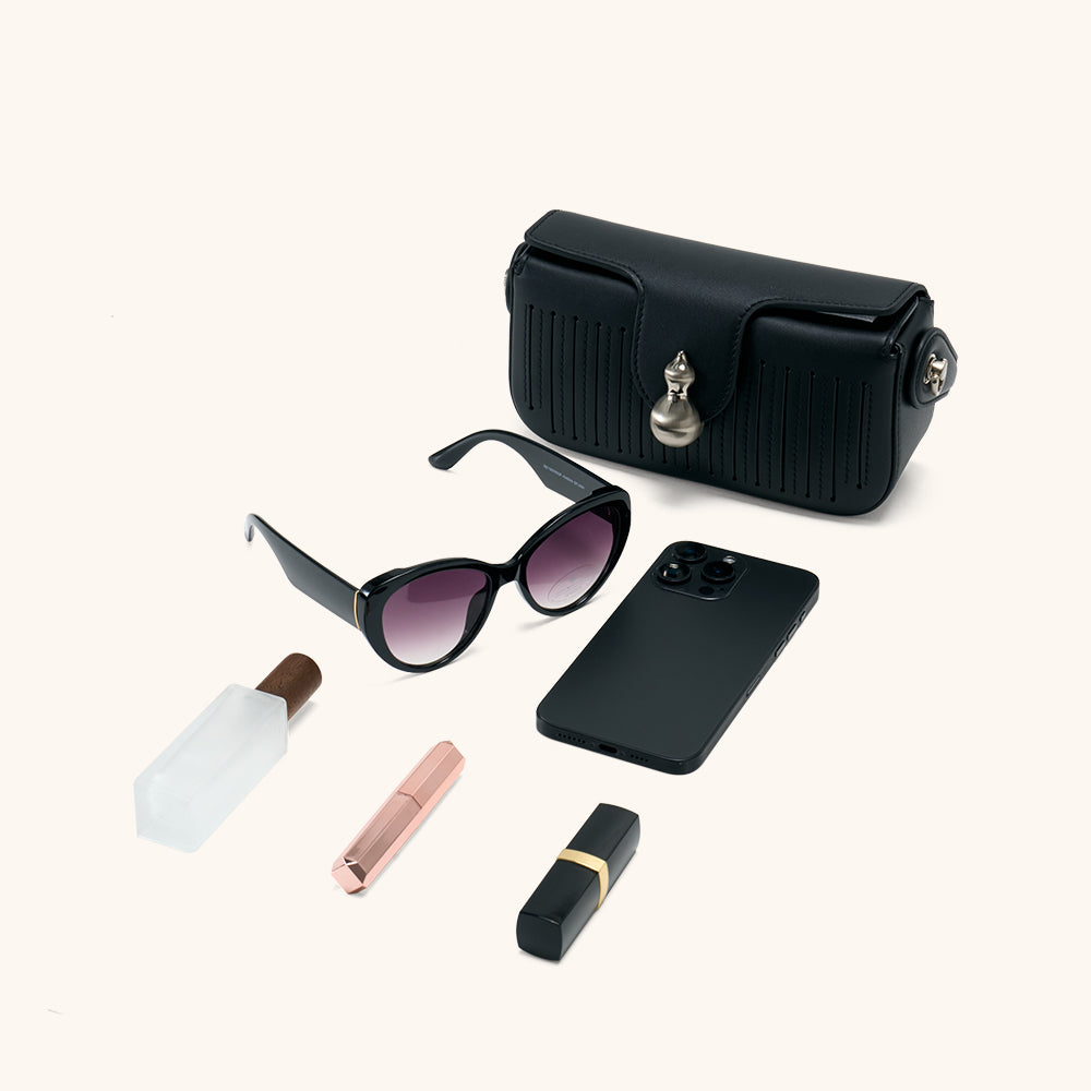 Items laid out to show Bampo Latch Boxy Bag