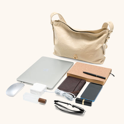 Items laid out to show Bampo Medium Flow Hobo capacity