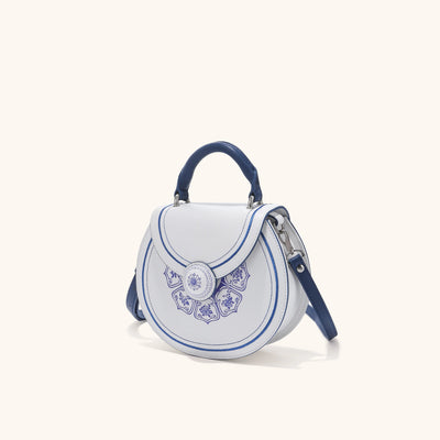 side view of Bampo blue and white porcelain handbag